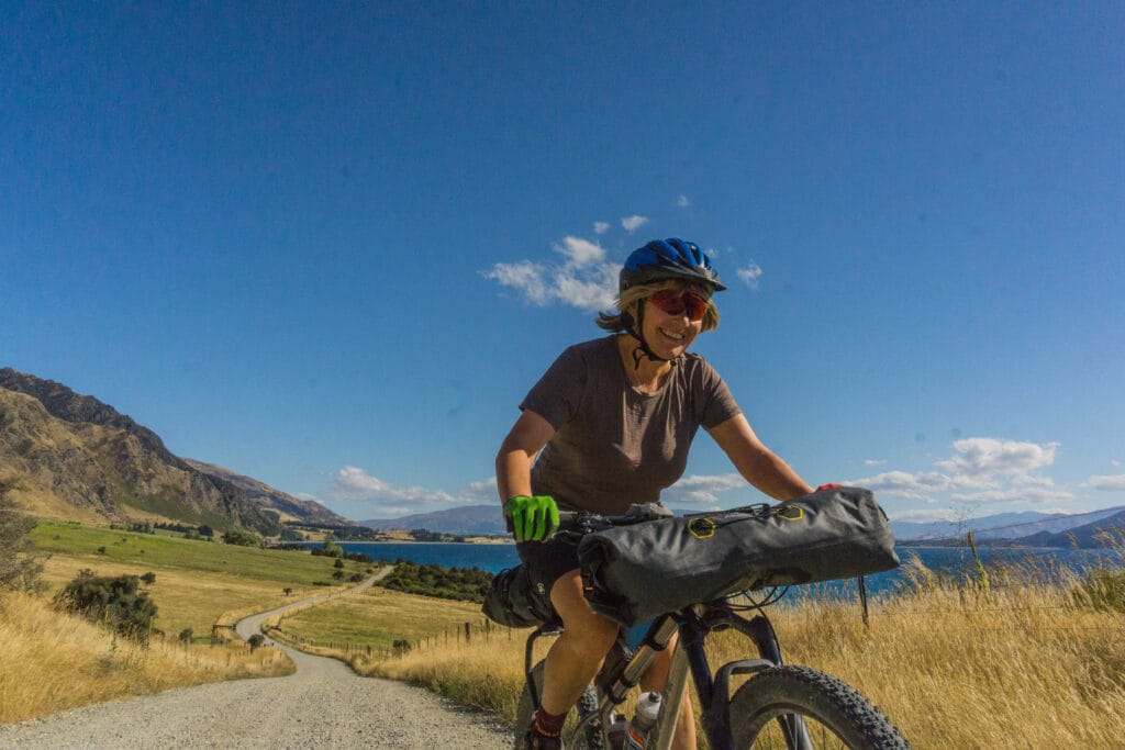 a smiling female bikepacker
