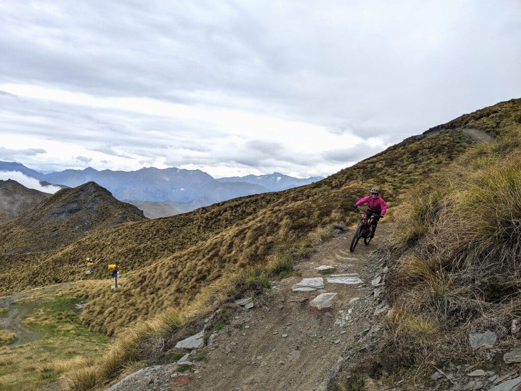 guided-mtb-trip-female-rider-new-zealand female rider on guided mtb trip in new zealand