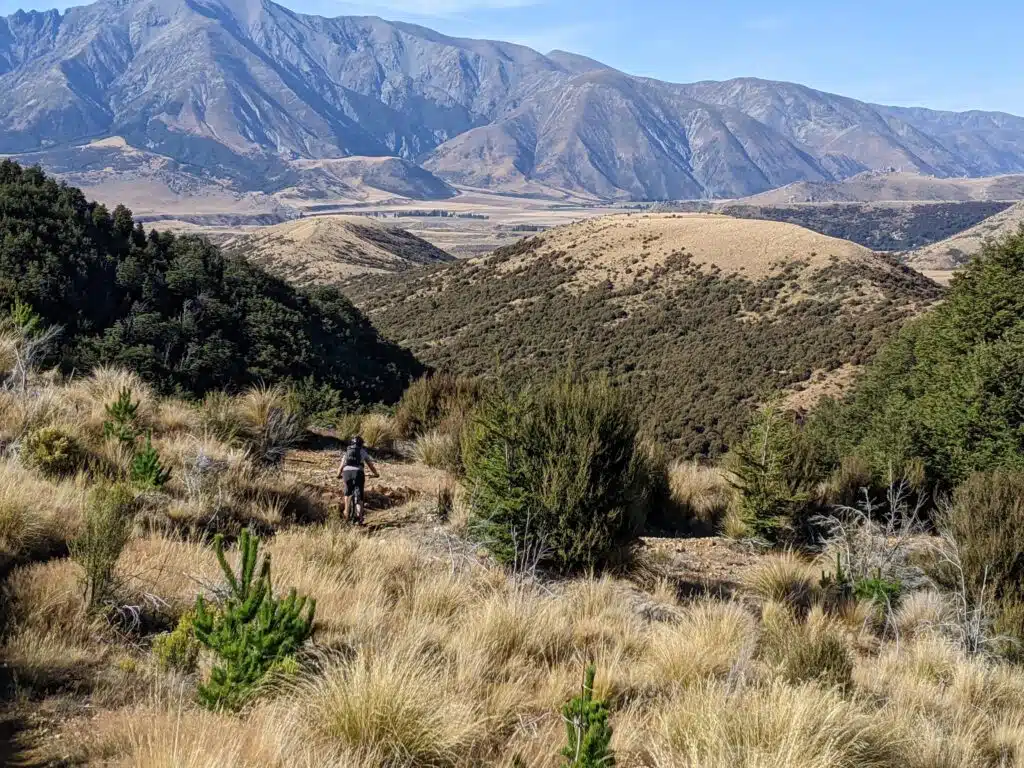 solo mtb rider in the mountains on mtb tour