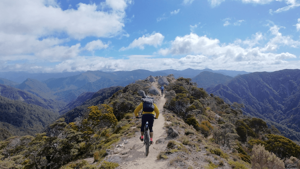 two mountain bike riders on the skyline ridge