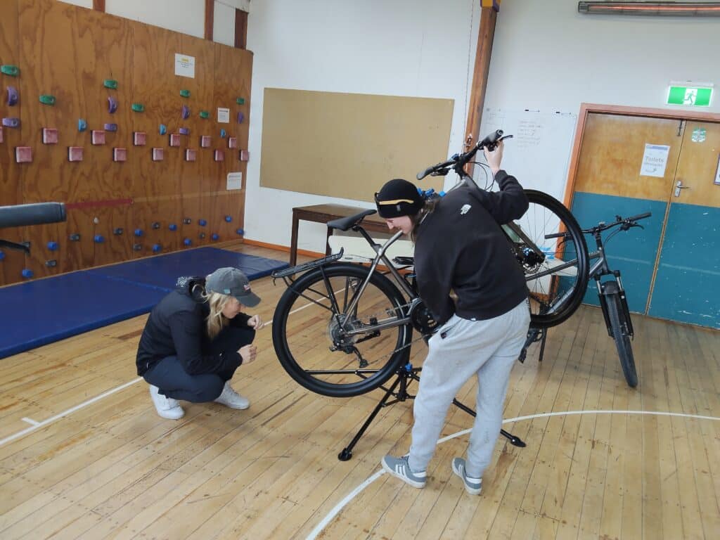 2 bikepackers on bike mechanics course in christchurch